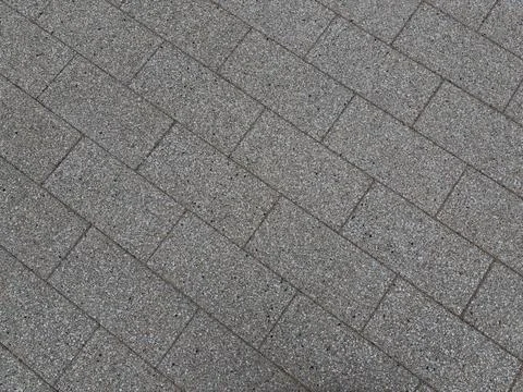 Grey Brick Pattern Paving Stones Laid in Diagonal Rows Stock Photos