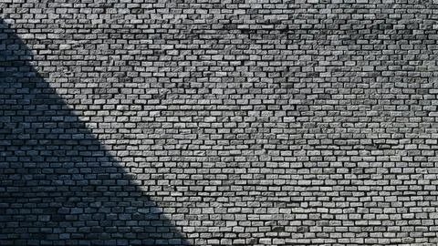 Grey brick wall background design with shadow Stock Photos