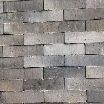 Grey brick wall background Stock Photos