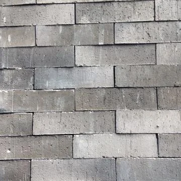 Grey brick wall background Stock Photos