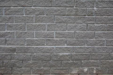 Grey brick wall background Stock Photos