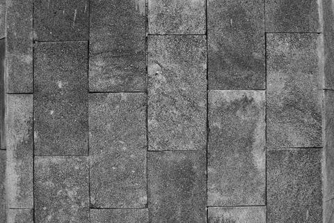 Grey brick wall or road, old stone textured background. 写真素材
