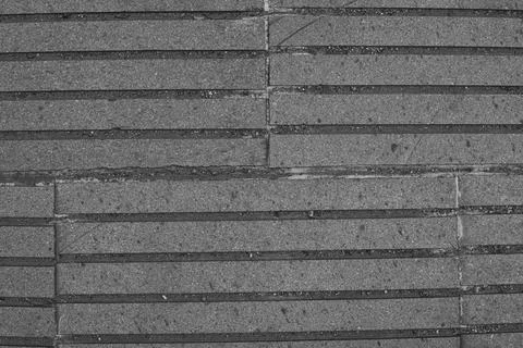 Grey brick wall or road, old stone pavement textured background. 스톡 사진