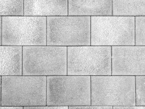 Grey brick wall texture background. Tiled. Stock Photos