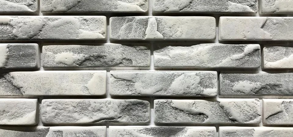 Grey brick wall texture background. Tiled with cope space Stock Photos