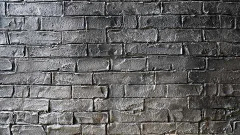 Grey brick wall texture. Dark brick wall background. Foto stock