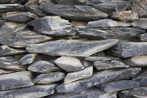 Grey bricks slate texture background . Vintage stone wall texture close up Stock Photos