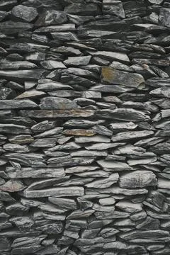 Grey bricks slate texture background . Slate wall texture . vertical shot Stock Photos