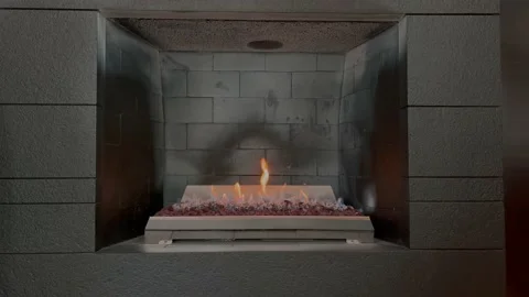 Grey briks fireplace with burning fire Stock Footage 207983281