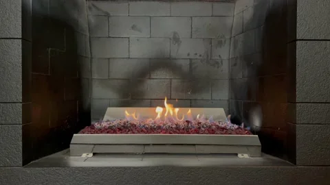 Grey briks fireplace with burning fire Stock Footage 208830006