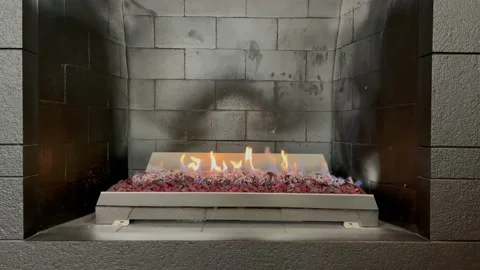 Grey briks fireplace with burning fire Stock Footage 210277706