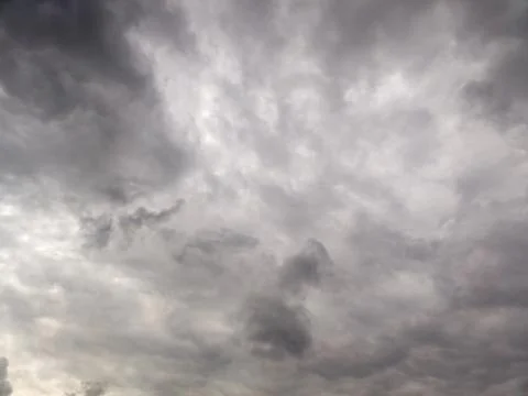 Grey broad storm clouds background, upward view Stock Photos