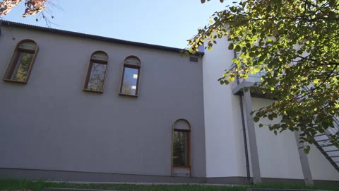 Grey building facade with arch windows and doors in city Stock Footage 313830709