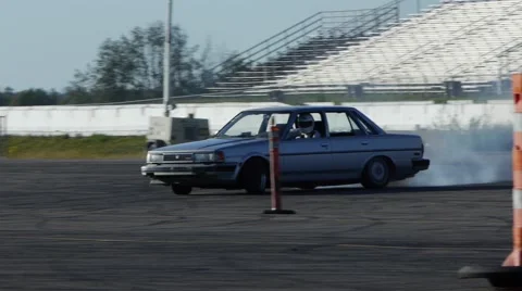 Grey car drifting around track at drift practice event. Video stock 59746816