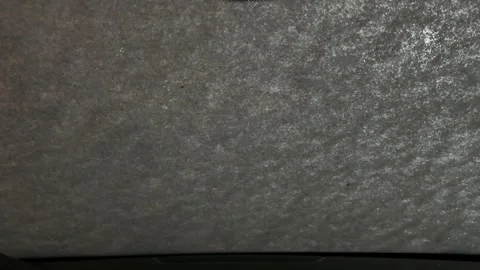 A grey car windshield with a white paper on it Stock Footage 273445177