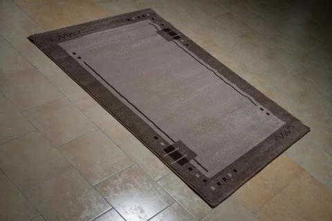 Grey carpet lying on floor Stock Photos