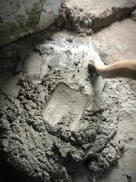Grey cement with a hoe Stock Photos