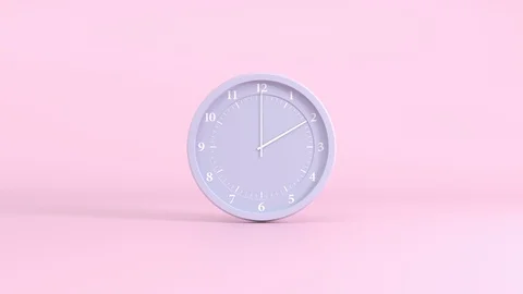 Grey clock with white numbers and hands on a pink background, time interval Stock Footage 129456409