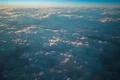 The grey clouds against the background of sunset. View from airplane Photo