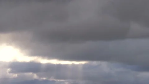Grey clouds and golden sunbeams -4/8- at sunrise - 4k Time Lapse Video Stock Footage 138202408