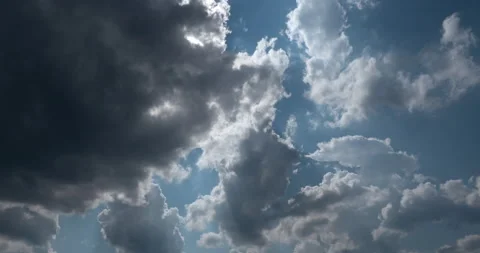 Grey Clouds Covering The Sun and Blue Sky Timelapse Stock-Footage 141152616