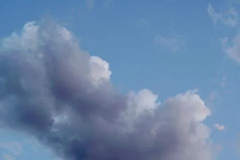 Grey clouds on a light blue sky Stock-Fotos