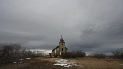 Grey clouds move over an abandoned church in this time lapse Stock Footage 150712368