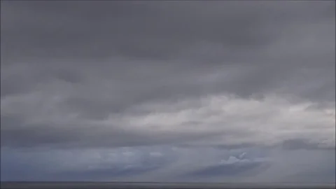 Grey clouds over the ocean time lapse 32x Video stock 81607475