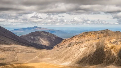 Grey clouds sky over volcanic mountain nature in sunny Tongariro park Time Lapse Stock Footage 106342339