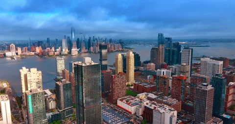 Grey cloudscape covers the sky over majestic skyscrapers of Jersey City and Stock Footage 334447242