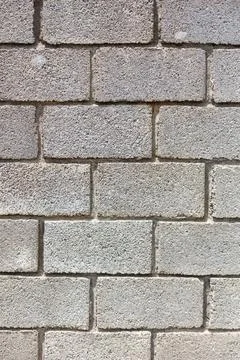 Grey concrete blocks form a sturdy wall Stock Photos
