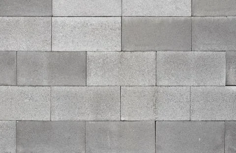 Grey concrete brick wall texture background, material of industry constructio Stock Photos