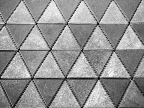 Grey concrete floor, triangle pattern background. Stock Photos