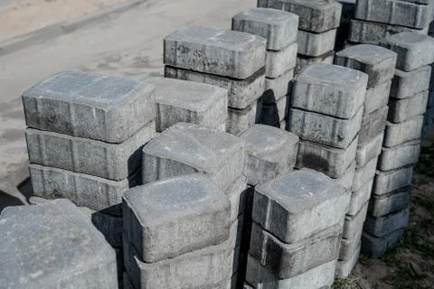 Grey concrete paving slabs in a stack. Stock Photos