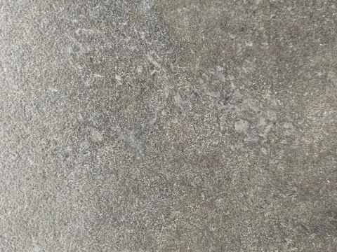 Grey concrete surface with spots. Grey cement background with texture.  Stock Photos