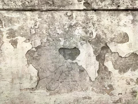 Grey Concrete Texture old wall with peeling paint, scratches and cracks Stock Photos