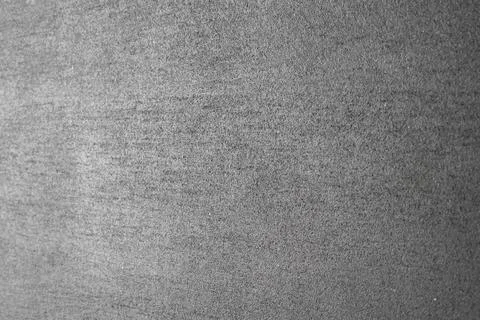 Grey concrete wall background with vertical focal point in the center. Stock Photos