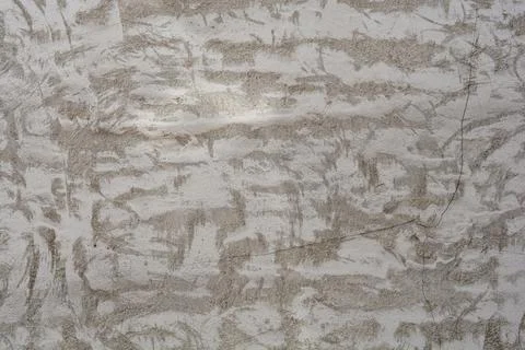 Grey concrete wall texture with abstract patterns in a full frame background 库存照片