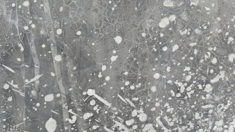 Grey concrete wall texture with white paint splatters and grunge distressed Stock Photos