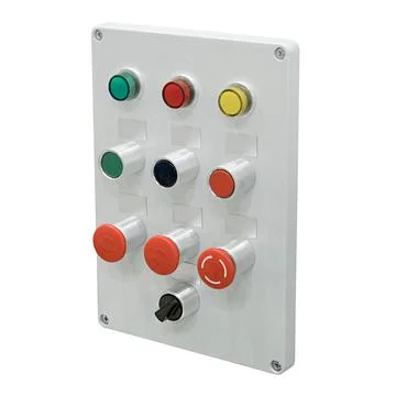 Grey control panel with assorted red, green, yellow and black electric butt.. Stock Photos