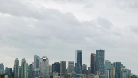 Grey day monochrome time-lapse of clouds over Calgary city skyline Stock Footage 314839693