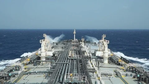 Grey deck tanker is moving through the sea - time lapse. Stock Footage 77364974