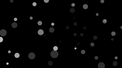 Grey dots of various sizes on a black background with a white space below Stock Footage 336591382