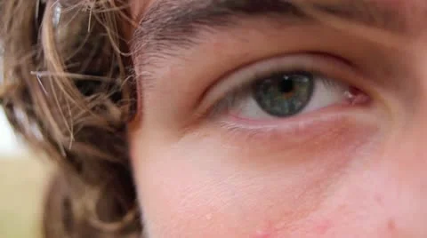 Grey eye of a young man. C. U. Stock Footage 10308955