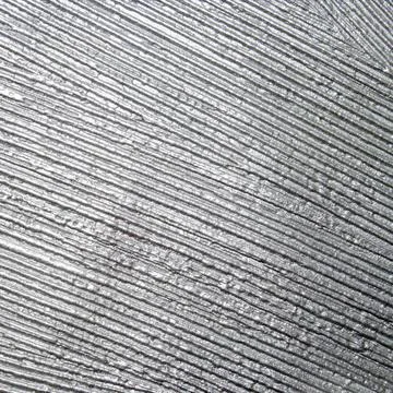 Grey fluted plaster background.The wall is plastered in gray stripes. Stock Photos