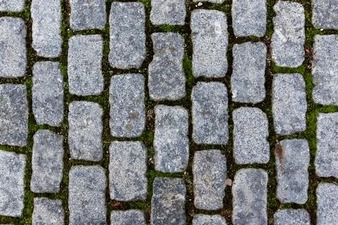 Grey granite cobblestone pavement texture background top view Stock Photos
