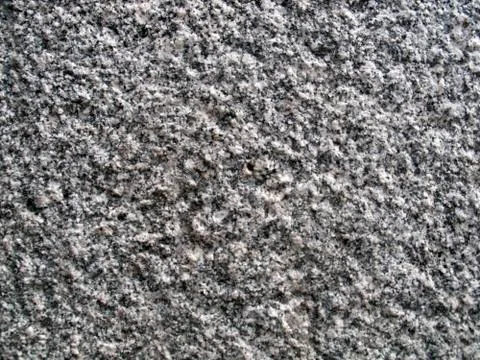 Grey granular granite texture Stock Photos