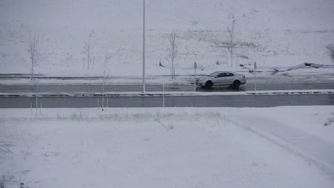 Grey Gray Car Driving Down Winter Road With Lots Of Snow Tracking Right To L Stock-Footage 121200742
