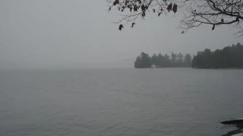 Grey haze silhouettes the shoreline 스톡 동영상 166570189