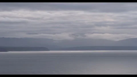 Grey hills over s silver sea Stock Footage 296517563